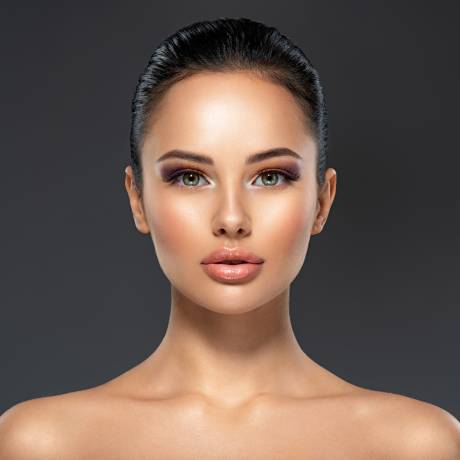 Front portrait of the woman with beauty face - isolated. Beauty face of the young beautiful girl with a healthy skin. Attractive female with a beautiful eyes. Skin care concept.
